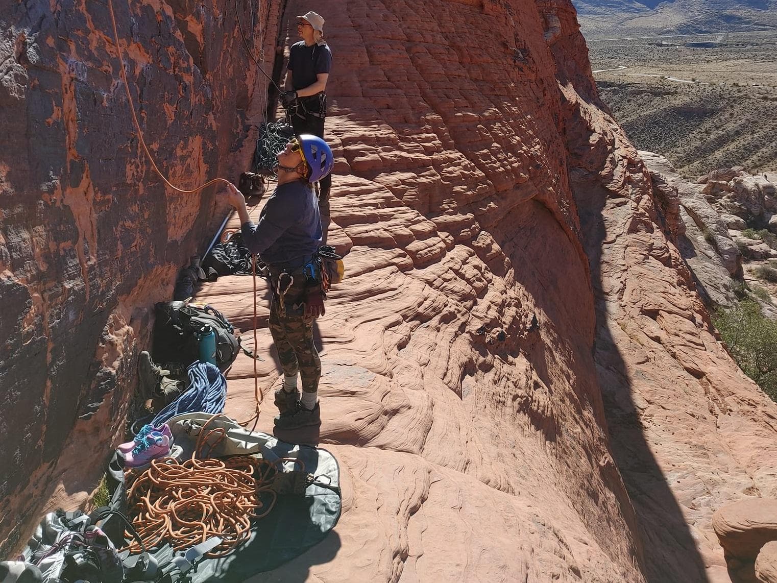 Precarious belay spot next to a dropoff